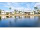 Apartment buildings reflected in a calm lake at 1398 Shady Pine Way # E3, Tarpon Springs, FL 34688