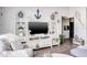 Living room with white media console and coastal decor at 1398 Shady Pine Way # E3, Tarpon Springs, FL 34688
