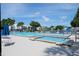 Resort-style pool and spa with lake views at 1398 Shady Pine Way # E3, Tarpon Springs, FL 34688