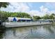 Community pool and lakefront view at 1398 Shady Pine Way # E3, Tarpon Springs, FL 34688