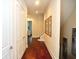 Bright hallway with hardwood floors and stylish wall art at 1413 Bayshore Blvd # 9, Dunedin, FL 34698