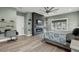 Bright bedroom features a modern fireplace, large windows, and plenty of natural light at 14214 Quintessa Ln, Lithia, FL 33547
