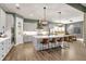 Spacious kitchen with island, stainless steel appliances and hardwood floors at 14214 Quintessa Ln, Lithia, FL 33547