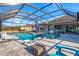 Resort-style pool and spa with covered patio and lounge chairs at 14214 Quintessa Ln, Lithia, FL 33547