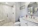 Bathroom with shower, vanity, and marble countertop at 1455 Briarwood Ct, Safety Harbor, FL 34695