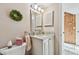 Elegant bathroom with granite countertop and updated vanity at 1455 Briarwood Ct, Safety Harbor, FL 34695