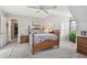 Spacious bedroom with wooden bed frame and ample natural light at 1455 Briarwood Ct, Safety Harbor, FL 34695