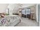 Bright bedroom with a queen bed and a rocking chair at 1455 Briarwood Ct, Safety Harbor, FL 34695
