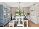 Dining room with table, chairs, bench, and china cabinet at 1455 Briarwood Ct, Safety Harbor, FL 34695