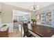 Dining room with table, chairs, and view into living room at 1455 Briarwood Ct, Safety Harbor, FL 34695