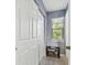 Bright entryway with a bench and built-in storage at 1455 Briarwood Ct, Safety Harbor, FL 34695