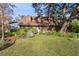 Attractive home exterior with wood siding and landscaping at 1455 Briarwood Ct, Safety Harbor, FL 34695