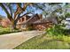 House exterior with driveway and landscaping at 1455 Briarwood Ct, Safety Harbor, FL 34695
