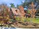 House exterior showcasing wood siding and landscaping at 1455 Briarwood Ct, Safety Harbor, FL 34695