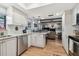 Updated kitchen features stainless steel appliances and granite countertops at 1455 Briarwood Ct, Safety Harbor, FL 34695