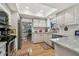 Bright kitchen with stainless steel appliances and granite countertops at 1455 Briarwood Ct, Safety Harbor, FL 34695