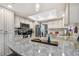 Spacious kitchen island with granite countertop at 1455 Briarwood Ct, Safety Harbor, FL 34695
