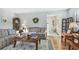 Spacious living room with hardwood floors, sofas, and a view to the entry at 1455 Briarwood Ct, Safety Harbor, FL 34695