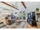 Living room with hardwood floors and access to the backyard at 1455 Briarwood Ct, Safety Harbor, FL 34695