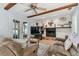 Cozy living room with fireplace and hardwood floors at 1455 Briarwood Ct, Safety Harbor, FL 34695