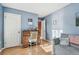 Bright office space with a roll top desk and gray couch at 1455 Briarwood Ct, Safety Harbor, FL 34695