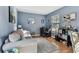 Home office features a desk, comfortable couch, and ample natural light at 1455 Briarwood Ct, Safety Harbor, FL 34695