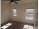 Bright bedroom with neutral walls and carpeting at 2566 Sea Wind Way, Clearwater, FL 33763