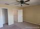 Upstairs bedroom with carpet and ceiling fan at 2566 Sea Wind Way, Clearwater, FL 33763