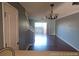 View of living room with hardwood floors and access to backyard at 2566 Sea Wind Way, Clearwater, FL 33763