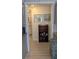 Hallway with wood-look flooring and built-in shelving at 26341 Dayflower Blvd, Wesley Chapel, FL 33544