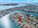 An aerial view of waterfront homes with access to the open water at 280 N Julia Cir, St Pete Beach, FL 33706