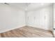 Bright bedroom features hardwood floors, recessed lighting, and built in closet with storage drawers at 280 N Julia Cir, St Pete Beach, FL 33706