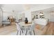 Open concept living room with modern furniture, chandelier, and kitchen island at 280 N Julia Cir, St Pete Beach, FL 33706