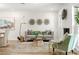 A bright living room with a modern fireplace and lots of natural light at 280 N Julia Cir, St Pete Beach, FL 33706