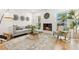 A bright living room with a modern fireplace and lots of natural light at 280 N Julia Cir, St Pete Beach, FL 33706