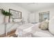 A bright main bedroom with a walk-in closet and ensuite bathroom at 280 N Julia Cir, St Pete Beach, FL 33706