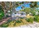 House with mature trees and a front yard at 2921 24Th S Ave, St Petersburg, FL 33712