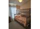 Bedroom with bunk beds and window coverings at 30119 Wellesley Way, Wesley Chapel, FL 33543