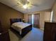 Bright bedroom with carpeted floors and ceiling fan at 30119 Wellesley Way, Wesley Chapel, FL 33543