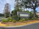 Community entrance sign with landscaping at 30119 Wellesley Way, Wesley Chapel, FL 33543
