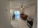 Dining area with wooden table and access to the kitchen at 30119 Wellesley Way, Wesley Chapel, FL 33543