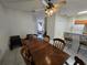 Dining room with wooden table and view of kitchen at 30119 Wellesley Way, Wesley Chapel, FL 33543