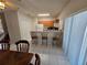 Small kitchen with breakfast bar and white appliances at 30119 Wellesley Way, Wesley Chapel, FL 33543