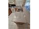 Kitchen boasts a large island with granite countertops and a double sink at 30119 Wellesley Way, Wesley Chapel, FL 33543