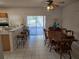 Kitchen with breakfast bar and access to backyard patio at 30119 Wellesley Way, Wesley Chapel, FL 33543