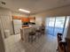 Small kitchen with breakfast bar and view to backyard at 30119 Wellesley Way, Wesley Chapel, FL 33543