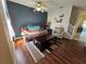 Living room with brown couches and wood-look floors at 30119 Wellesley Way, Wesley Chapel, FL 33543