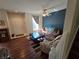 Living room with brown couches and wood-look floors at 30119 Wellesley Way, Wesley Chapel, FL 33543