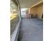 Covered patio with plenty of space for outdoor furniture at 30119 Wellesley Way, Wesley Chapel, FL 33543