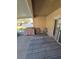 Relaxing screened patio with seating and a grill at 30119 Wellesley Way, Wesley Chapel, FL 33543